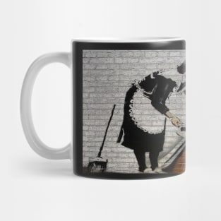 Banksy's Sweeping it Under the Carpet Mug